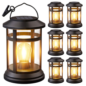 NFEVER solar lantern hanging outdoors with warm LED glow for cozy evenings.