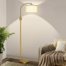 Nintiue arc floor lamp with gold linen shade illuminating a cozy corner