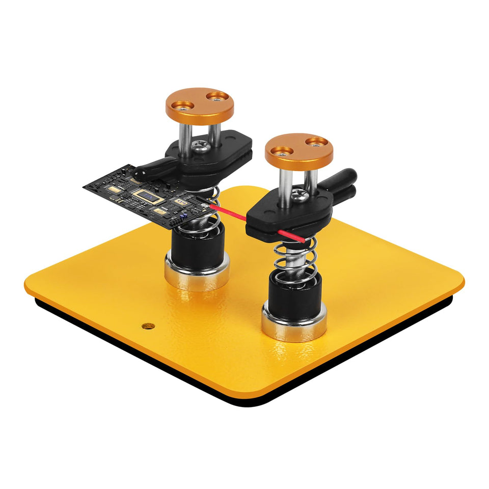 NOEVSBIG dual-head clamp securing a PCB for precise soldering
