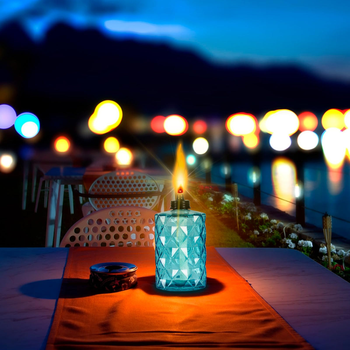 Nonley citronella torches arranged around garden create inviting space.