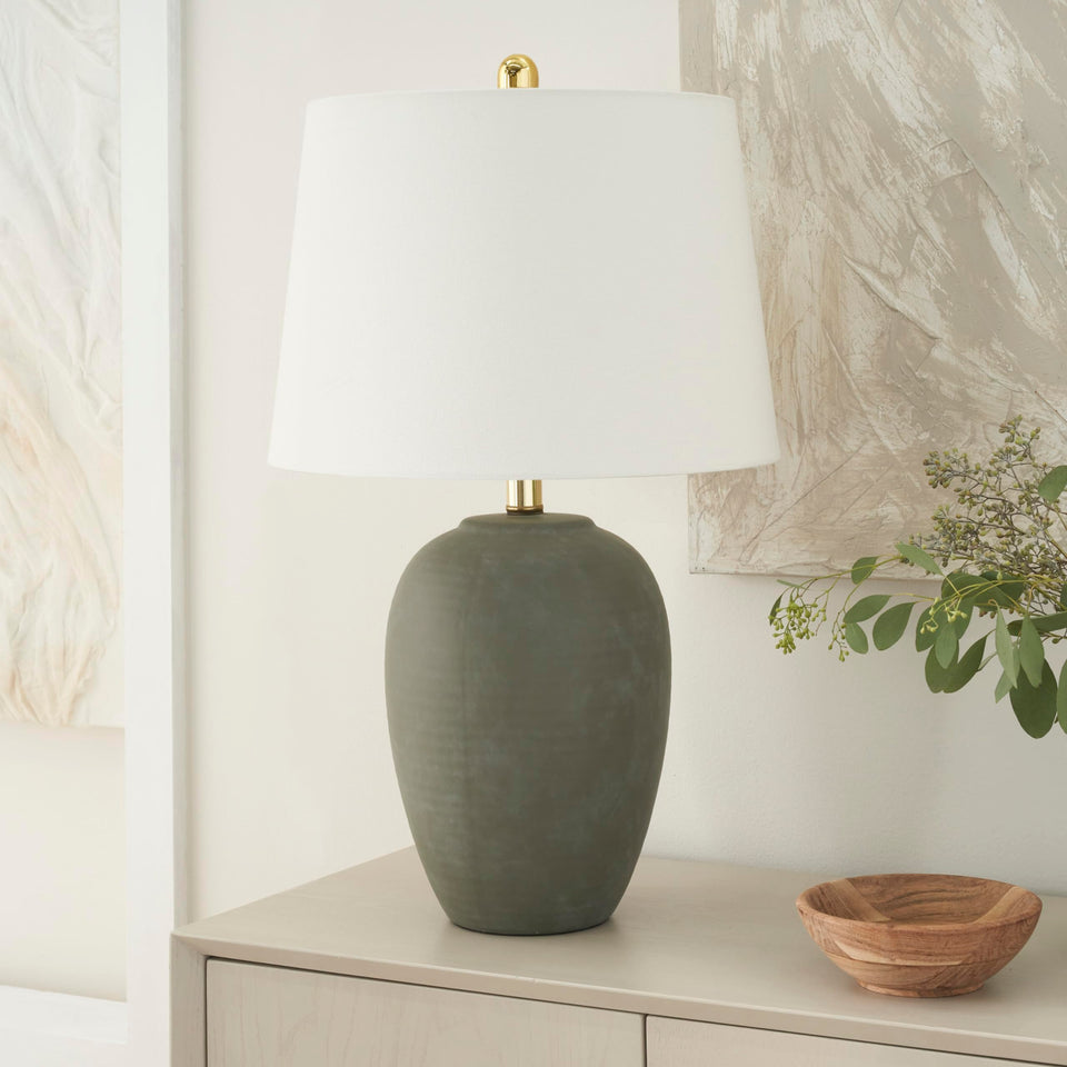 Nourison Home olive green ceramic pot lamp seen from front view, elevating space ambience
