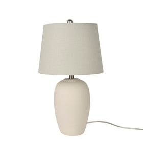 Nourison Home lamp close-up shows smooth glaze and off-white shade.