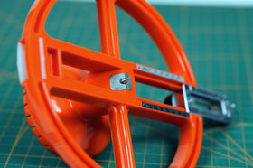 NT Cutter circle cutter creating carpet holes for installation work.