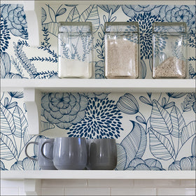 NuWallpaper Navy Secret Garden room idea; creates a serene focal wall.