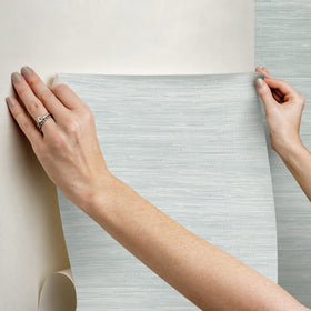 Installation with repositionable wallpaper for precise alignment