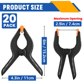 NUITPY heavy-duty black clips gripping a photo backdrop for stability.