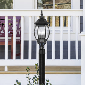 Nuvo 3 Light post lantern mounted outdoors for reliable perimeter lighting.