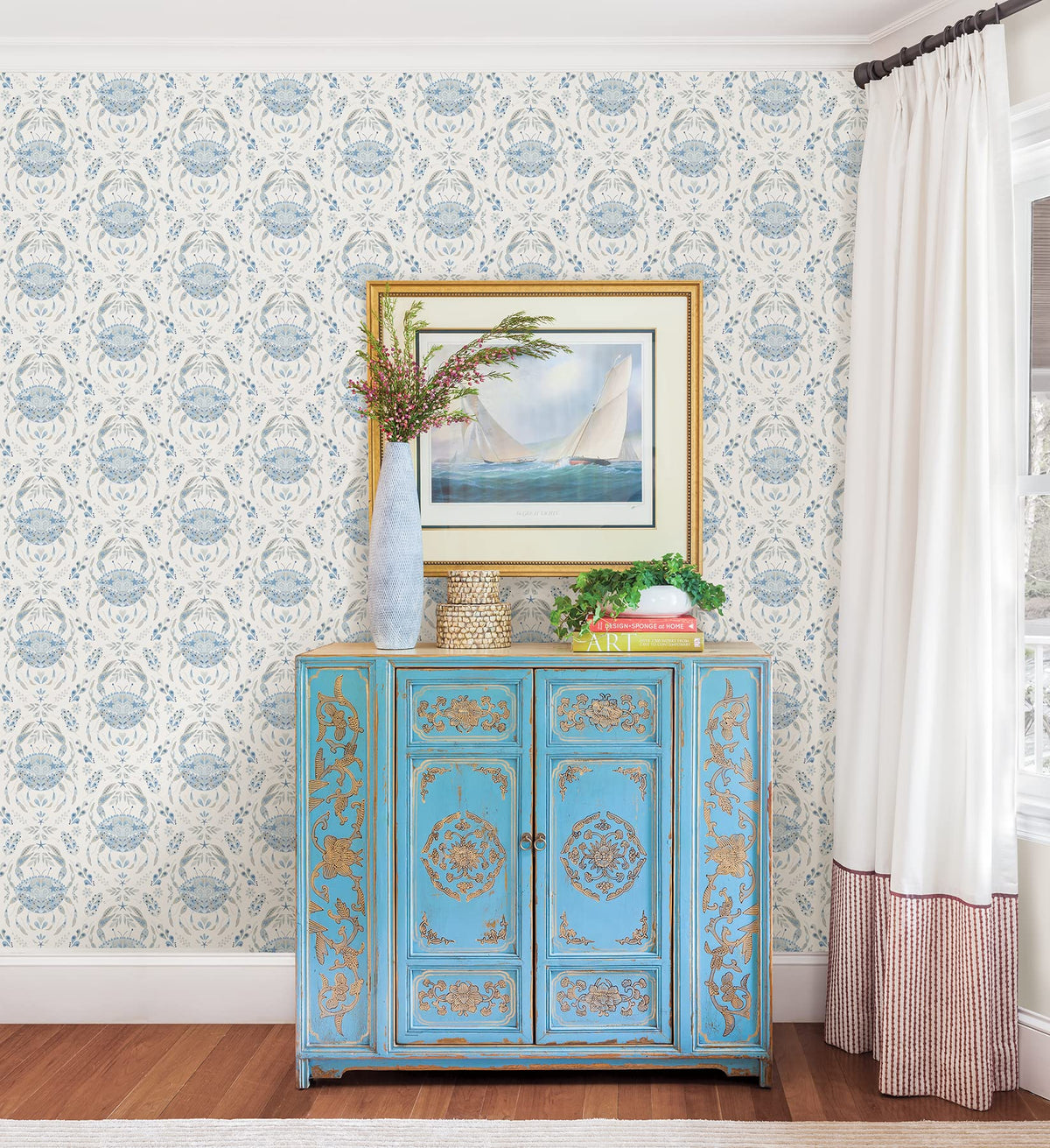 NuWallpaper Blue Shellby damask wall application demonstrates peel-and-stick convenience.