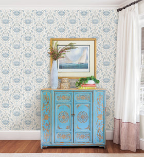 NuWallpaper Blue Shellby damask wall application demonstrates peel-and-stick convenience.