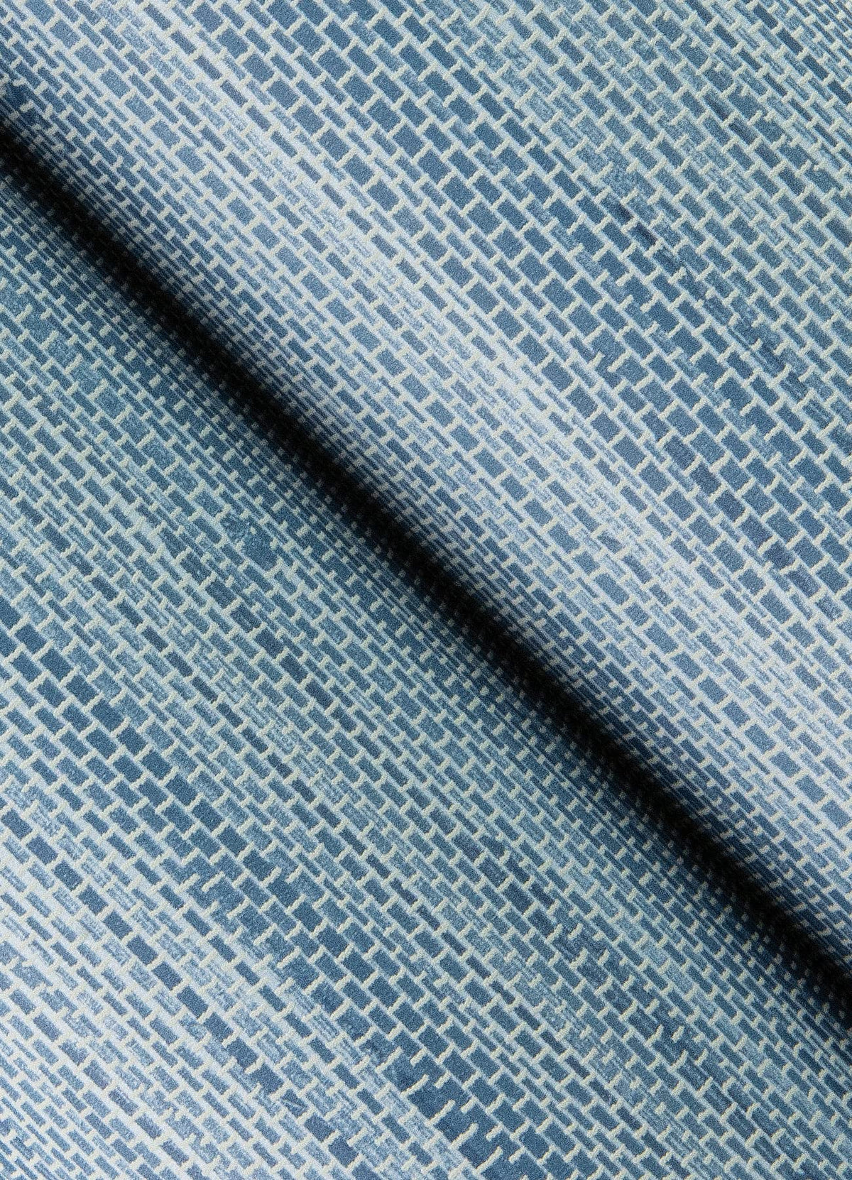 NuWallpaper Society Social Mineral Blue wall application closeup demonstrates easy peel and stick installation.