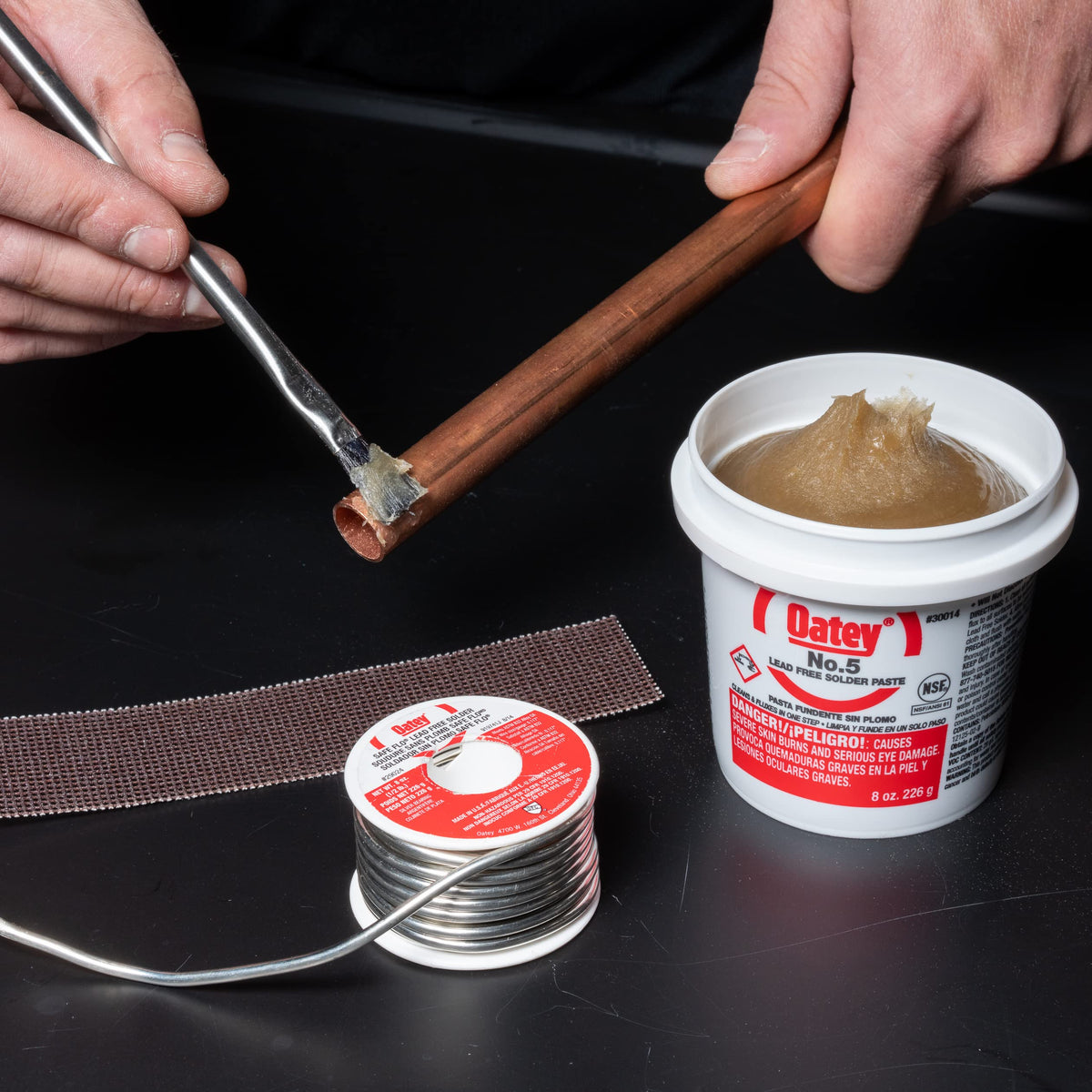 Oatey application brush shows easy flux application for consistent coverage.