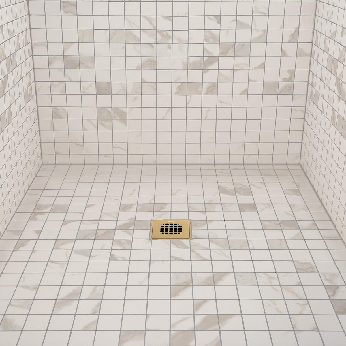 Oatey durable stainless steel square strainer in a tile/shower setting.