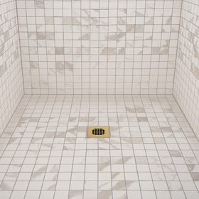 Oatey durable stainless steel square strainer in a tile/shower setting.