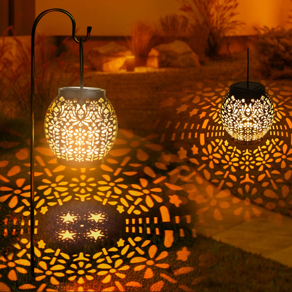ODEETRONIC two-pack warm white lanterns project star patterns for romantic garden evenings.
