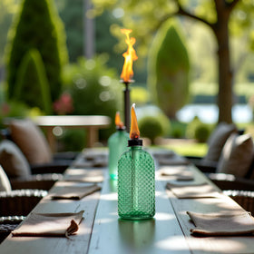 OEXEO Citronella torches shine on outdoor patios as decorative decor.