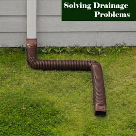 Ogutter downspout extension buried underground for discreet drainage.