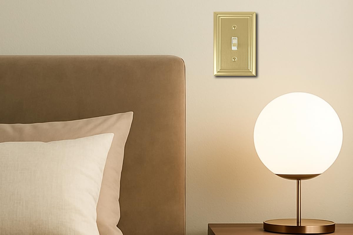 OKAWYC Adler brushed-brass wall plate complements living room decor.