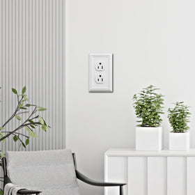 OKAWYC Adler outlet cover white installed on wall, offers a refined, cohesive look.