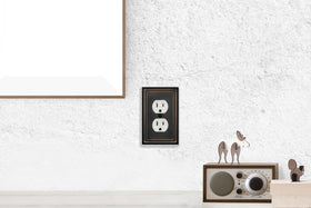 OKAWYC Belaire beaded wall plate shown in a living room setup