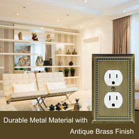 OKAWYC Belaire receptacle cover in antique brass complements living room and kitchen decor
