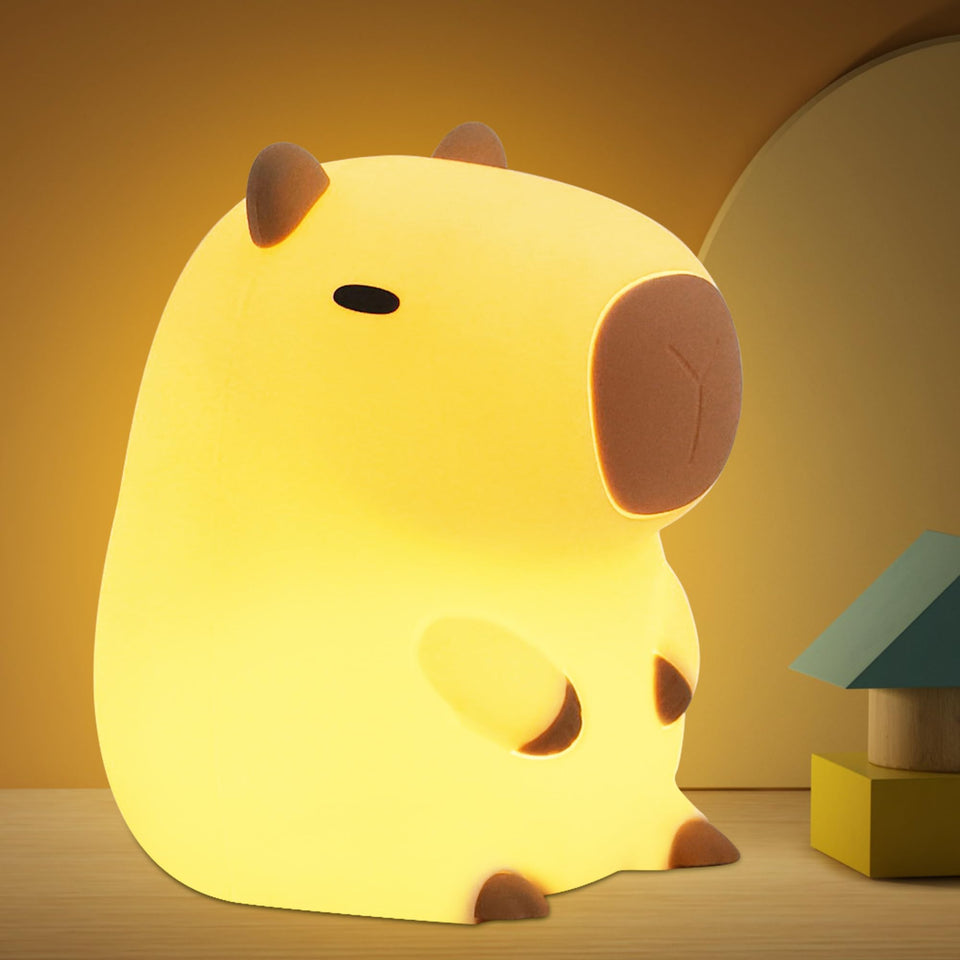OkiyiD Capybara Night Lamp on a table with a warm glow for cozy evenings