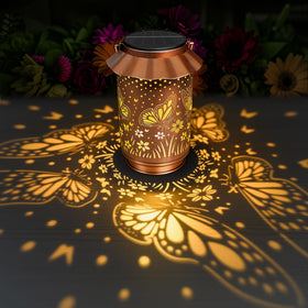 Ollny solar butterfly lantern outdoors with warm glow for garden decor.