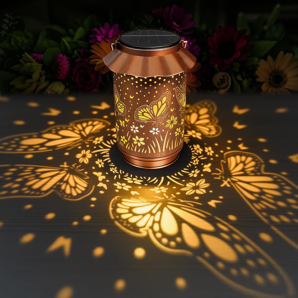 Ollny solar butterfly lantern outdoors with warm glow for garden decor.
