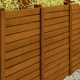 Close-up of brush applying OLYMPIC WaterGuard Cedar stain for even coverage