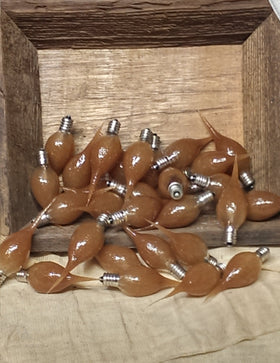 On The Bright Side 5W bulb in rustic brown enhances night-light ambiance.