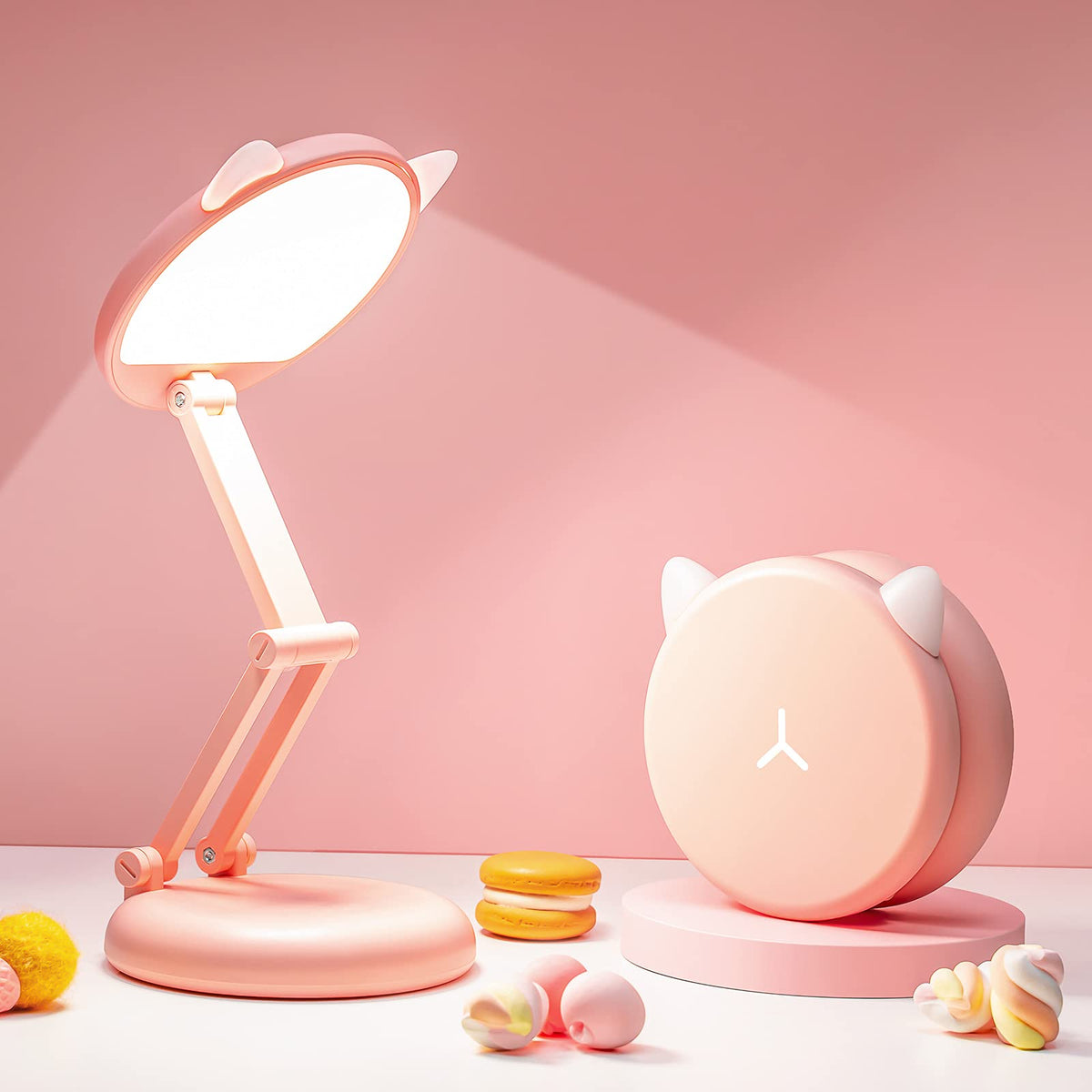 One Fire cute desk lamp pink foldable on desk, space-saving dorm accessory.