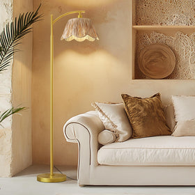 Oneach Arc Floor Lamp with gold base and slender pole adds modern contrast to rustic decor.