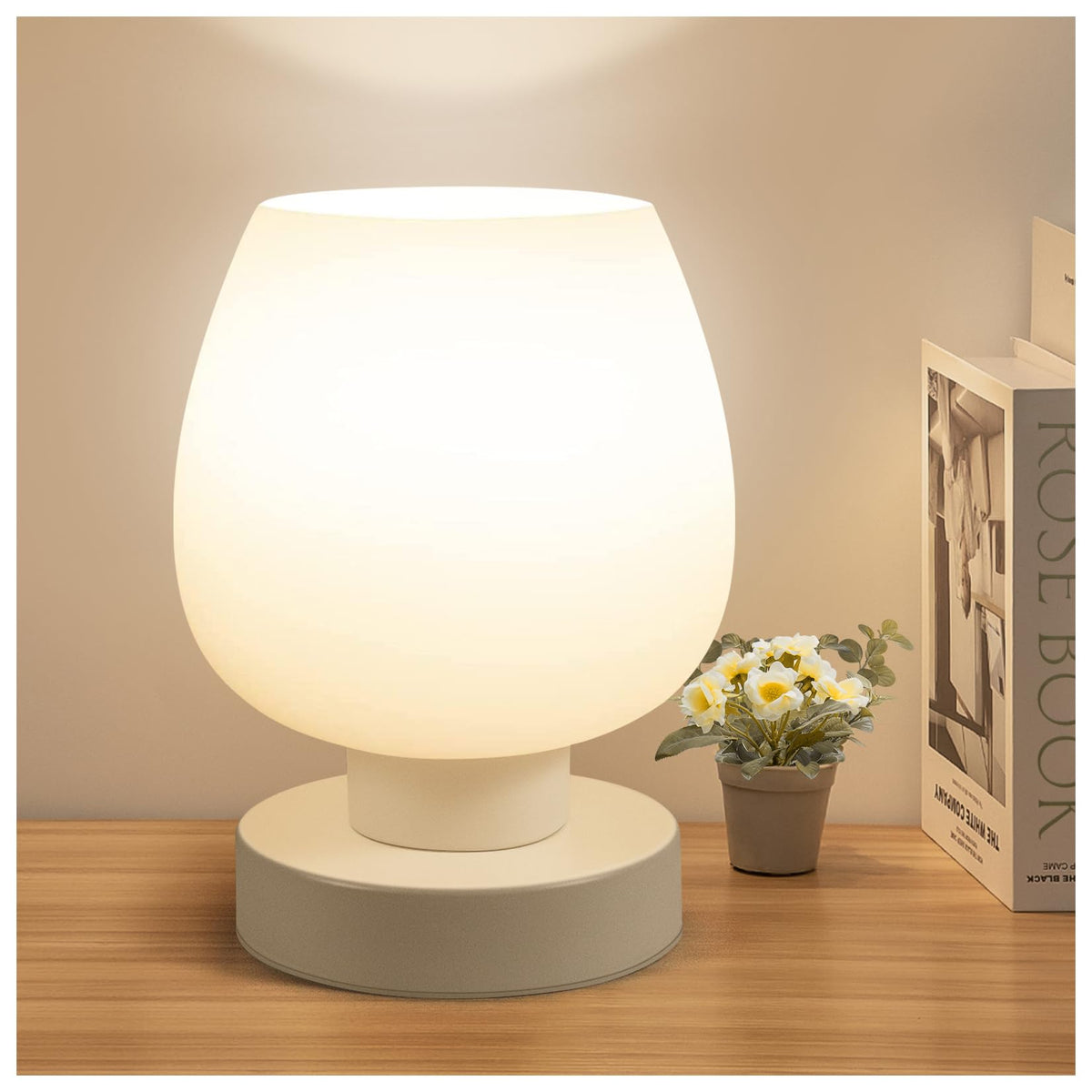ONEWISH small bedside lamp with opal shade diffuses light softly.