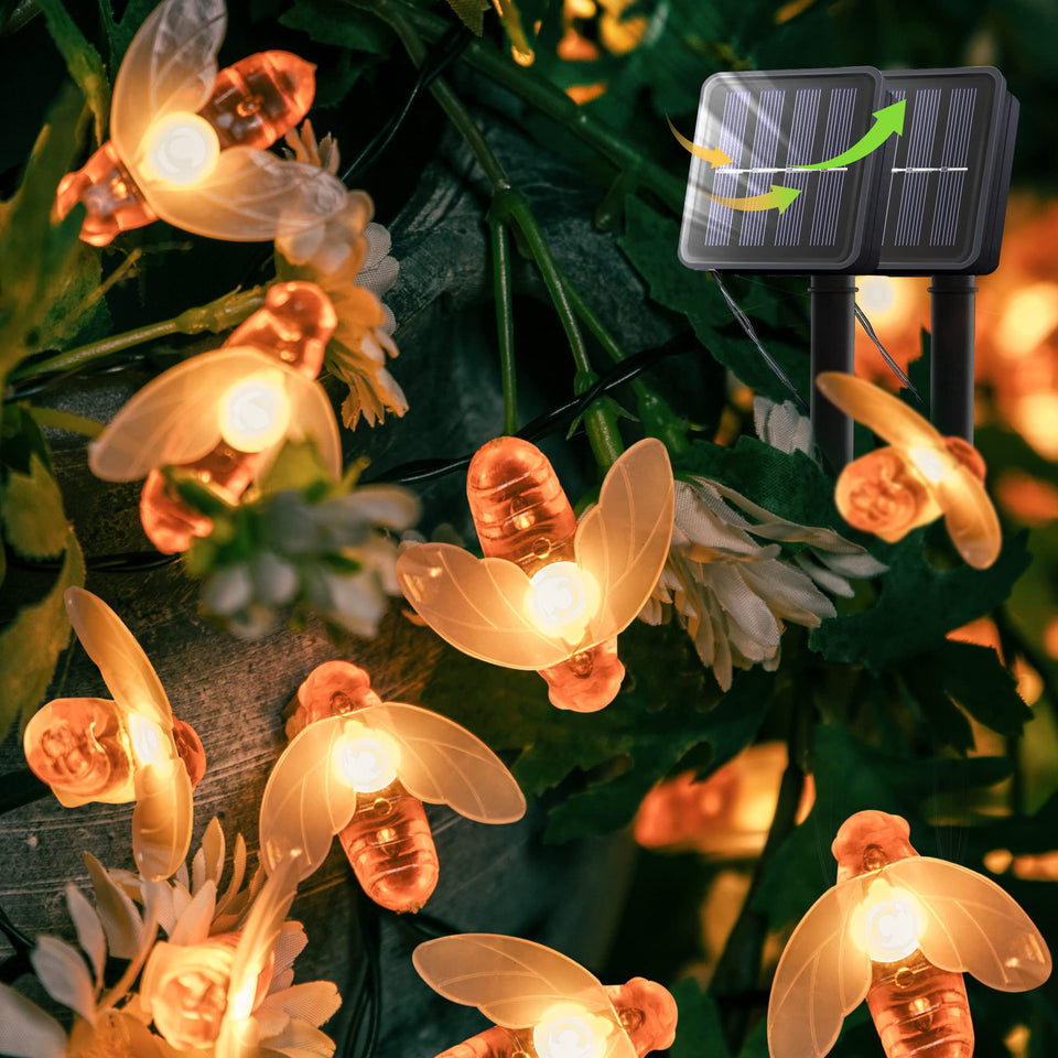 Oopswow solar bee string lights illuminate a 20ft garden path with warm white glow.