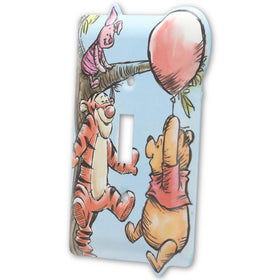Open Road Brands Winnie the Pooh switch plate with blue sky background enhances playful rooms.