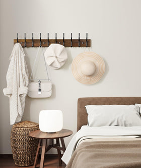 Optish warm brown finish coat rack complements rustic decor