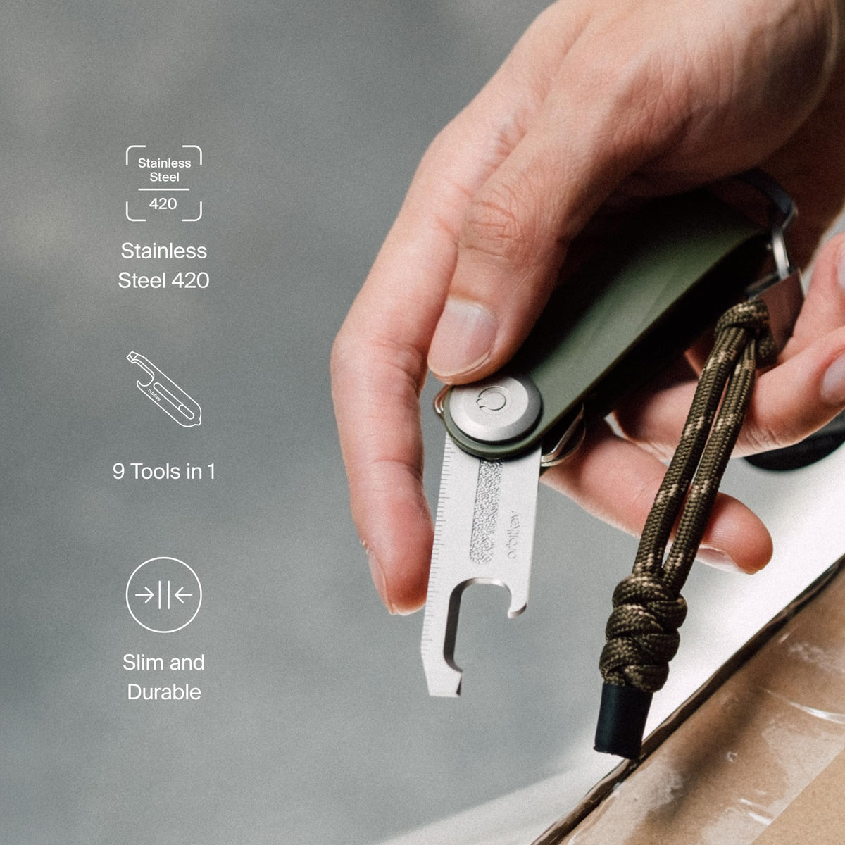 Orbitkey Multi-Tool V2 Black in action opening a bottle with ease.