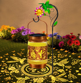 ostritec hummingbird solar garden lantern with metal mesh lights up paths at night.