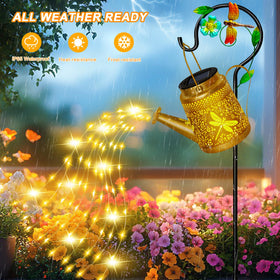 Ostritec Large Frog Watering Can Light casts cascading patterns across the garden.