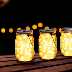 Ostritec mason jar lights enhance garden or patio décor.