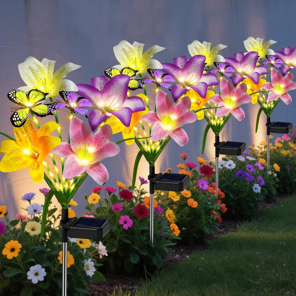 ostr i te c Solar lilies with butterflies illuminate outdoor spaces with lifelike daytime color