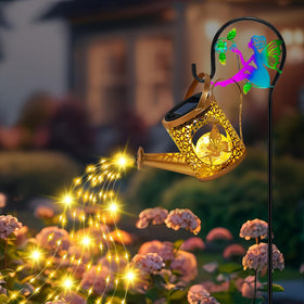 Ostritec Solar Watering Can Lights illuminate garden borders with warm glow