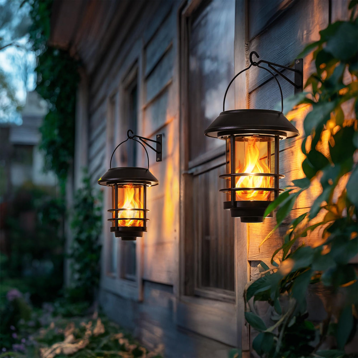 Otdair solar lanterns with glass shade casting warm flicker for patio evenings