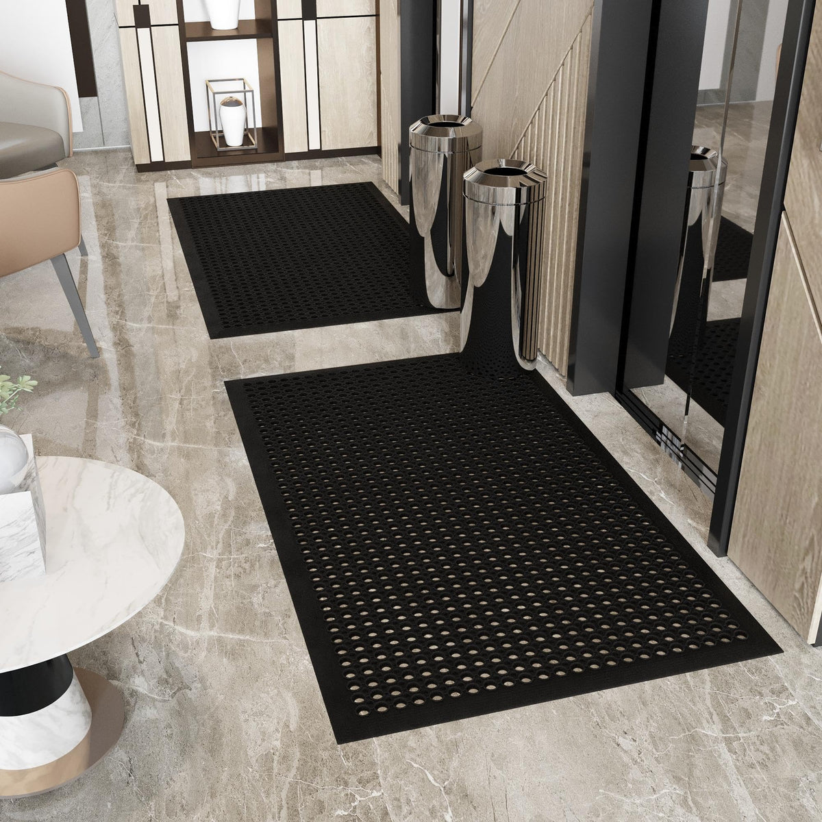 Ottomanson perforated-design floor mat shows drainage to reduce spill buildup.
