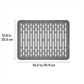 OXO Good Grips Silicone Sink Mat Large elevates with feet for improved water flow.