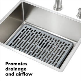 OXO Good Grips Silicone Sink Mat Large is heat-safe for hot cookware.