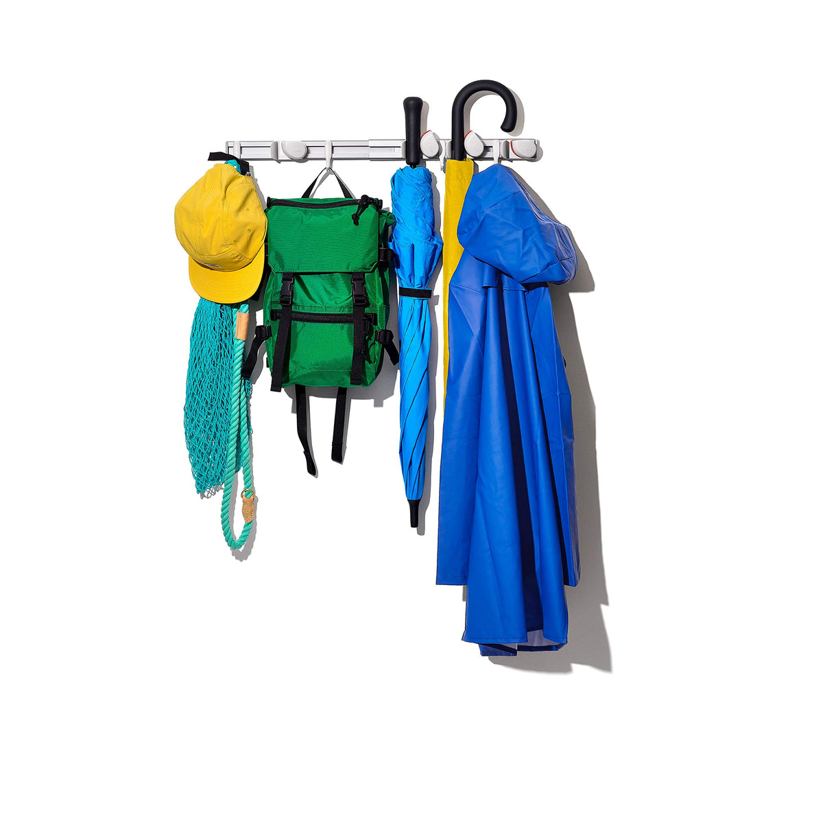 Sturdy hooks store sports equipment for quick entryway access.