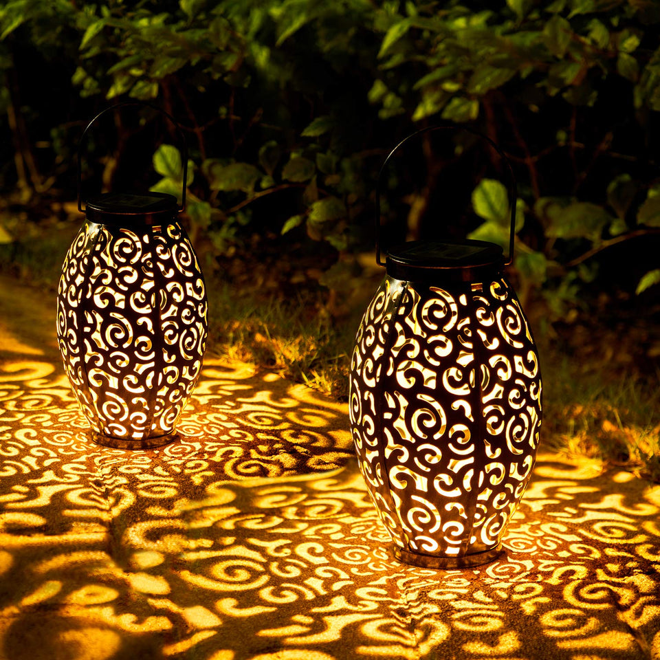 OxyLED solar lantern hanging in a garden creating warm ambiance