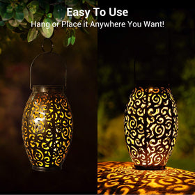 OxyLED solar lantern on a garden table at dusk