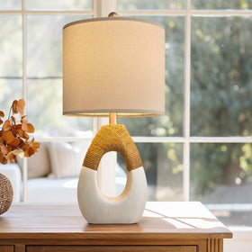 OYEARS bedside lamp on nightstand emits soft ambient light for relaxation.