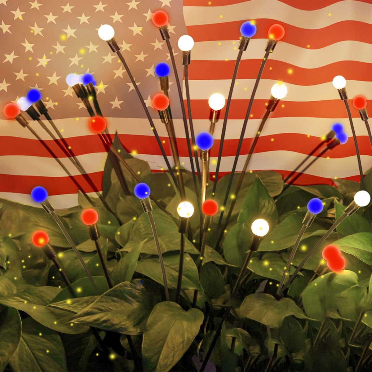 OZS 4pack solar American flag lights illuminating a patriotic backyard display